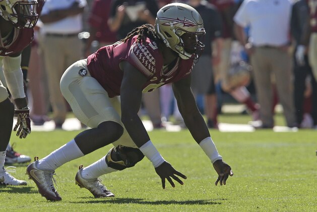 Florida State's Josh Sweat takes off on the snap during an NCAA college football game with Delaware State, Saturday, Nov. 18, 2017, in Tallahassee Fla. Florida State won 77-6. (AP Photo/Steve Cannon)
