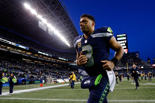SEATTLE, WA - DECEMBER 31:  Russell Wilson #3 of the Seattle Seahawks runs off the field against the Arizona Cardinals at CenturyLink Field on December 31, 2017 in Seattle, Washington.  (Photo by Jonathan Ferrey/Getty Images)