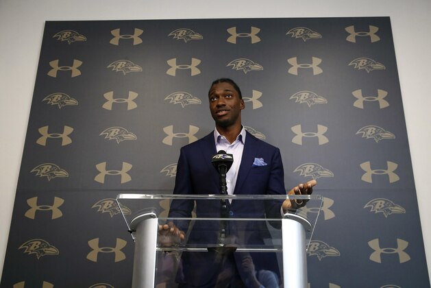 Newly-signed Baltimore Ravens backup quarterback Robert Griffin III speaks at an NFL football news conference at the team's headquarters in Owings Mills, Md., Wednesday, April 11, 2018. Griffin is returning to football after sitting out last season. (AP Photo/Patrick Semansky)