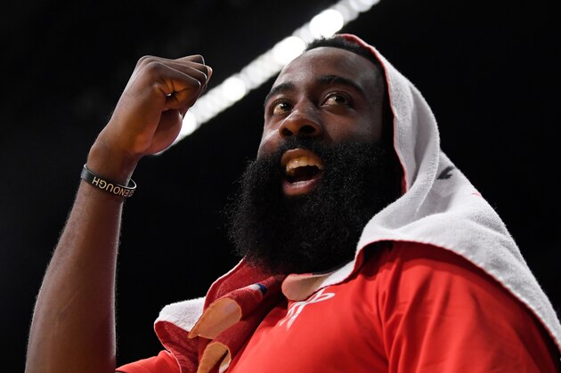 Houston Rockets guard James Harden gestures to a fan who was heckling him during the second half of the team's NBA basketball game against the Los Angeles Lakers on Tuesday, April 10, 2018, in Los Angeles. The Rockets won 105-99. (AP Photo/Mark J. Terrill)