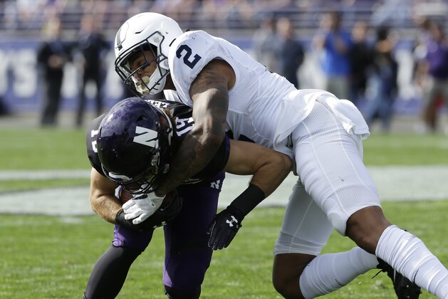 Penn State safety Marcus Allen, right, tackles Northwestern wide receiver Riley Lees during the first half of an NCAA college football game in Evanston, Ill., Saturday, Oct. 7, 2017. Penn State won 31-7. (AP Photo/Nam Y. Huh)