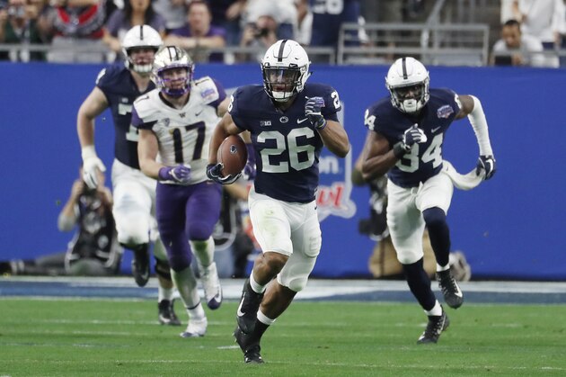 Penn State running back Saquon Barkley (26) against Washington during the Fiesta Bowl NCAA college football game, Saturday, Dec. 30, 2017, in Glendale, Ariz. (AP Photo/Rick Scuteri)