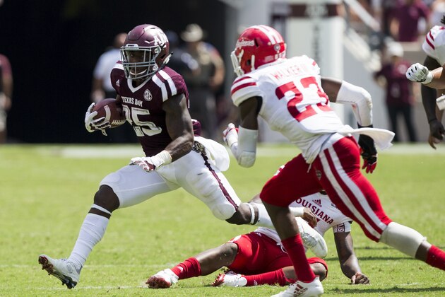 Texas A&M running back Kendall Bussey (25) turns the corner against Louisiana-Lafayette defensive back Tracy Walker (23) during the fourth quarter of an NCAA college football game Saturday, Sept. 16, 2017, in College Station, Texas. (AP Photo/Sam Craft)