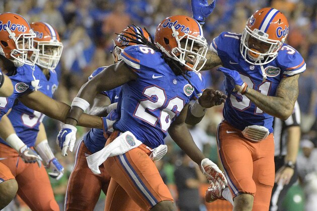 Florida defensive back Marcell Harris (26) is congratulated by defensive back Quincy Wilson (6) and defensive back Teez Tabor (31) after Harris intercepted a pass during the first half of an NCAA college football game against North Texas in Gainesville, Fla., Saturday, Sept. 17, 2016. (AP Photo/Phelan M. Ebenhack)