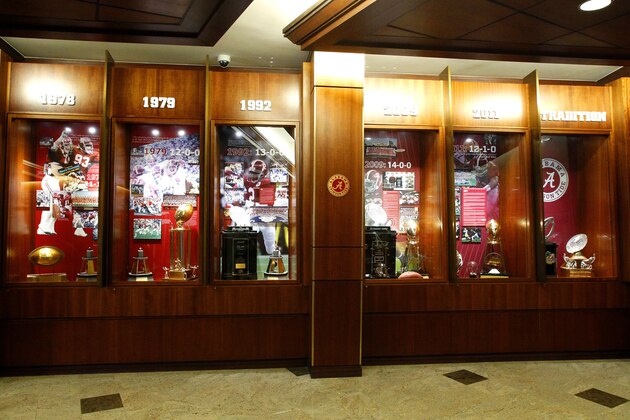 This Dec. 21, 2012, photo shows Alabama's trophy cases at the Mal M. Moore Athletic Facility in Tuscaloosa, Ala. (AP Photo/Butch Dill)