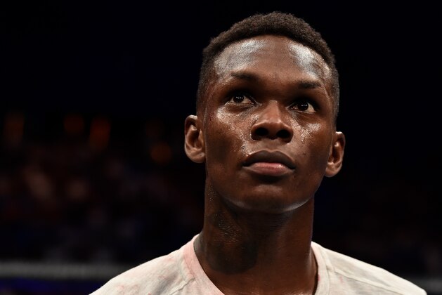 PERTH, AUSTRALIA - FEBRUARY 11:  Israel Adesanya of Nigeria celebrates his victory over Rob Wilkinson of Australia in their middleweight bout during the UFC 221 event at Perth Arena on February 11, 2018 in Perth, Australia. (Photo by Jeff Bottari/Zuffa LLC/Zuffa LLC via Getty Images)