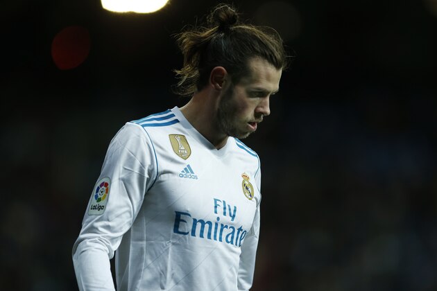 Real Madrid's Gareth Bale walks along the pitch during a Spanish La Liga soccer match between Real Madrid and Real Sociedad at the Santiago Bernabeu stadium in Madrid, Saturday, Feb. 10, 2018. Real Madrid defeated Real Sociedad 5-2. (AP Photo/Francisco Seco)