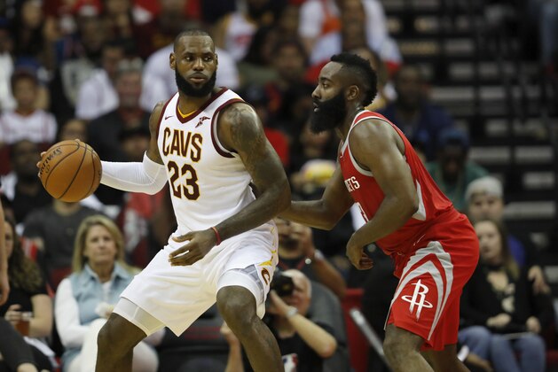 HOUSTON, TX - NOVEMBER 09:  LeBron James #23 of the Cleveland Cavaliers controls the ball against James Harden #13 of the Houston Rockets in the first half at Toyota Center on November 09, 2017 in Houston, Texas.  NOTE TO USER: User expressly acknowledges and agrees that, by downloading and or using this photograph, User is consenting to the terms and conditions of the Getty Images License Agreement.  (Photo by Tim Warner/Getty Images)