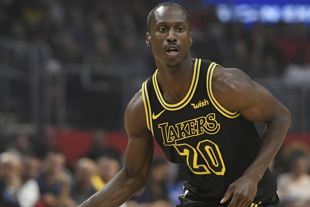 LOS ANGELES, CA - APRIL 11:  Andre Ingram #20 of the Los Angeles Lakers brings the ball up court in the first hafl at Staples Center on April 11, 2018 in Los Angeles, California. NOTE TO USER: User expressly acknowledges and agrees that, by downloading and or using this photograph, User is consenting to the terms and conditions of the Getty Images License Agreement. (Photo by John McCoy/Getty Images) *** Local Caption *** Andre Ingram