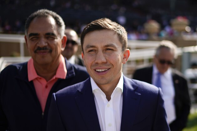 Boxer Gennady Golovkin visits Santa Anita Park Saturday, April 7, 2018, in Arcadia, Calif. (AP Photo/Jae C. Hong)