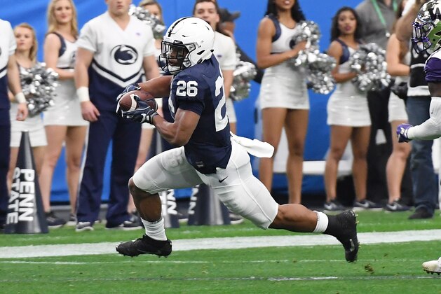 GLENDALE, AZ - DECEMBER 30:  Saquon Barkley #26 of Penn State Nittany Lions runs with the ball against the Washington Huskies during the Playstation Fiesta Bowl at University of Phoenix Stadium on December 30, 2017 in Glendale, Arizona.  (Photo by Norm Hall/Getty Images)