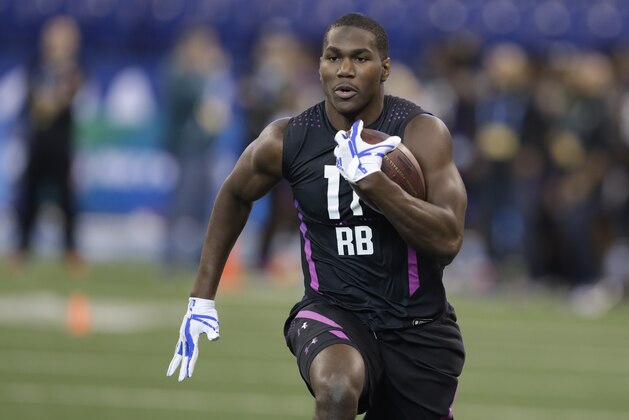 Auburn running back Kerryon Johnson runs a drill during the NFL football scouting combine, Friday, March 2, 2018, in Indianapolis. (AP Photo/Darron Cummings)