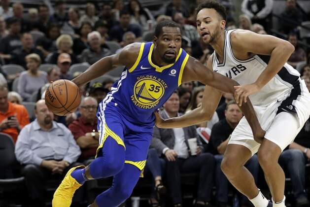 Golden State Warriors forward Kevin Durant (35) drives around San Antonio Spurs forward Kyle Anderson (1) during the first half of an NBA basketball game, Thursday, Nov. 2, 2017, in San Antonio. (AP Photo/Eric Gay)