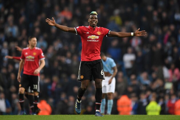 MANCHESTER, ENGLAND - APRIL 07:  Paul Pogba of Manchester United celebrates victory after the Premier League match between Manchester City and Manchester United at Etihad Stadium on April 7, 2018 in Manchester, England.  (Photo by Michael Regan/Getty Images)