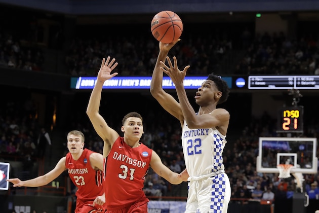 Kentucky guard Shai Gilgeous-Alexander (22) shoots as Davidson guard Kellan Grady (31) defends during the second half of a first-round game in the NCAA men's college basketball tournament Thursday, March 15, 2018, in Boise, Idaho. (AP Photo/Otto Kitsinger)