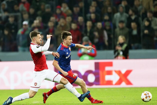 MOSCOW, RUSSIA - APRIL 12: Alexander Golovin of PFC CSKA Moskva vies for the ball with Aaron Ramsey of Arsenal FC during the UEFA Europa League quarter final leg two match between PFC CSKA Moskva and Arsenal FC at CSKA Arena stadium on April 12, 2018 in Moscow, Russia. (Photo by Oleg Nikishin/Getty Images) MOSCOW, RUSSIA - APRIL 12: Alexander Golovin of PFC CSKA Moskva vies for the ball with Aaron Ramsey of Arsenal FC during the UEFA Europa League quarter final leg two match between PFC CSKA Moskva and Arsenal FC at CSKA Arena stadium on April 12, 2018 in Moscow, Russia. (Photo by Oleg Nikishin/Getty Images)