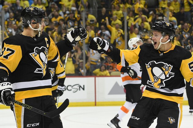 PITTSBURGH, PA - APRIL 11: Sidney Crosby #87 of the Pittsburgh Penguins celebrates with Jake Guentzel #59 after scoring a goal during the second period in Game One of the Eastern Conference First Round during the 2018 NHL Stanley Cup Playoffs against the Philadelphia Flyers at PPG PAINTS Arena on April 11, 2018 in Pittsburgh, Pennsylvania. (Photo by Justin Berl/Getty Images)