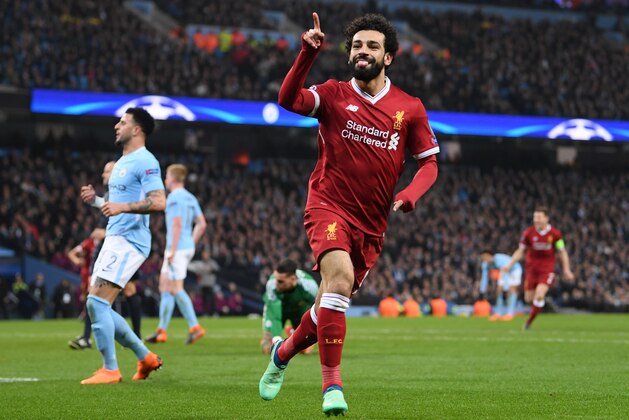 MANCHESTER, ENGLAND - APRIL 10:  Mohamed Salah of Liverpool celebrates scoring the first goal during the Quarter Final Second Leg match between Manchester City and Liverpool at Etihad Stadium on April 10, 2018 in Manchester, England.  (Photo by Laurence Griffiths/Getty Images,)
