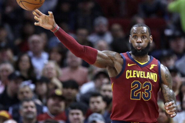 Cleveland Cavaliers' LeBron James passes the ball in the first half of an NBA basketball game against the New York Knicks, Wednesday, April 11, 2018, in Cleveland. (AP Photo/Tony Dejak)