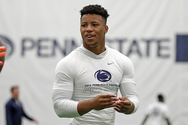 Penn State running back Saquon Barkley, tosses a football during Penn State Pro Day in State College, Pa., Tuesday, March 20, 2018. Barkley did not participate in the drills. (AP Photo/Gene J. Puskar)