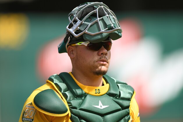 OAKLAND, CA - MARCH 31:  Bruce Maxwell #13 of the Oakland Athletics looks on as he walks to the dugout prior to the start of his game against the Los Angeles Angels of Anaheim at Oakland Alameda Coliseum on March 31, 2018 in Oakland, California.  (Photo by Thearon W. Henderson/Getty Images)