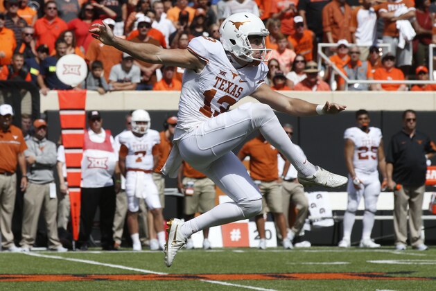 FILE - In this Oct. 3, 2016, file photo, Texas punter Michael Dickson (13) kicks during an NCAA college football game against Oklahoma State, in Stillwater, Okla. Dickson was selected to the AP All-America team announced Monday, Dec. 11, 2017.AP Photo/Sue Ogrocki, File)