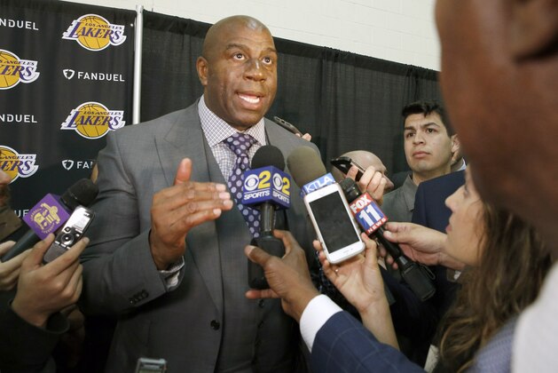 Magic Johnson, president of basketball operations for the Los Angeles Lakers, talks during a news conference announcing Rob Pelinka as the new general manager for the NBA basketball team, in El Segundo, Calif., Friday, March 10, 2017. Pelinka, who was Kobe Bryant's longtime agent, will work with Johnson to rebuild the 16-time NBA champions from the worst four-year stretch in team history. (AP Photo/Nick Ut)