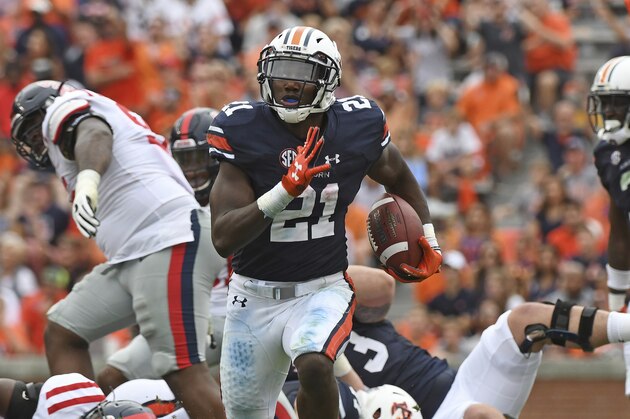 FILE - In this Oct. 7, 2017, file photo, Auburn running back Kerryon Johnson (21) carries the ball during the first half of an NCAA college football game against Mississippi, in Auburn, Ala. No. 10 Auburn's offense has made huge strides since the Clemson game with the progress of quarterback Jarrett Stidham and the touchdown tear of tailback Kerryon Johnson. (AP Photo/Thomas Graning, File)