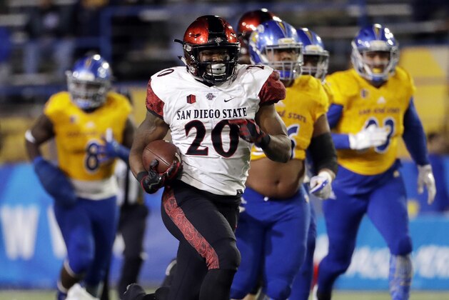 FILE - In this Saturday, Nov. 4, 2017 file photo, San Diego State running back Rashaad Penny runs against San Jose State during an NCAA college football game in San Jose, Calif. Two of college football’s most dominant rushing attacks will clash when San Diego State faces Army in the Armed Forces Bowl on Saturday, Dec. 23, 2017, even though the two offenses are dramatically different.(AP Photo/Marcio Jose Sanchez, File)