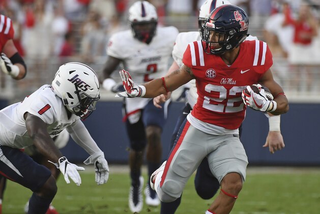 Mississippi running back Jordan Wilkins (22) looks for room past South Alabama safety Jeremy Reaves (1) during the first half of an NCAA college football game in Oxford, Miss., Saturday, Sept. 2, 2017. (AP Photo/Thomas Graning)