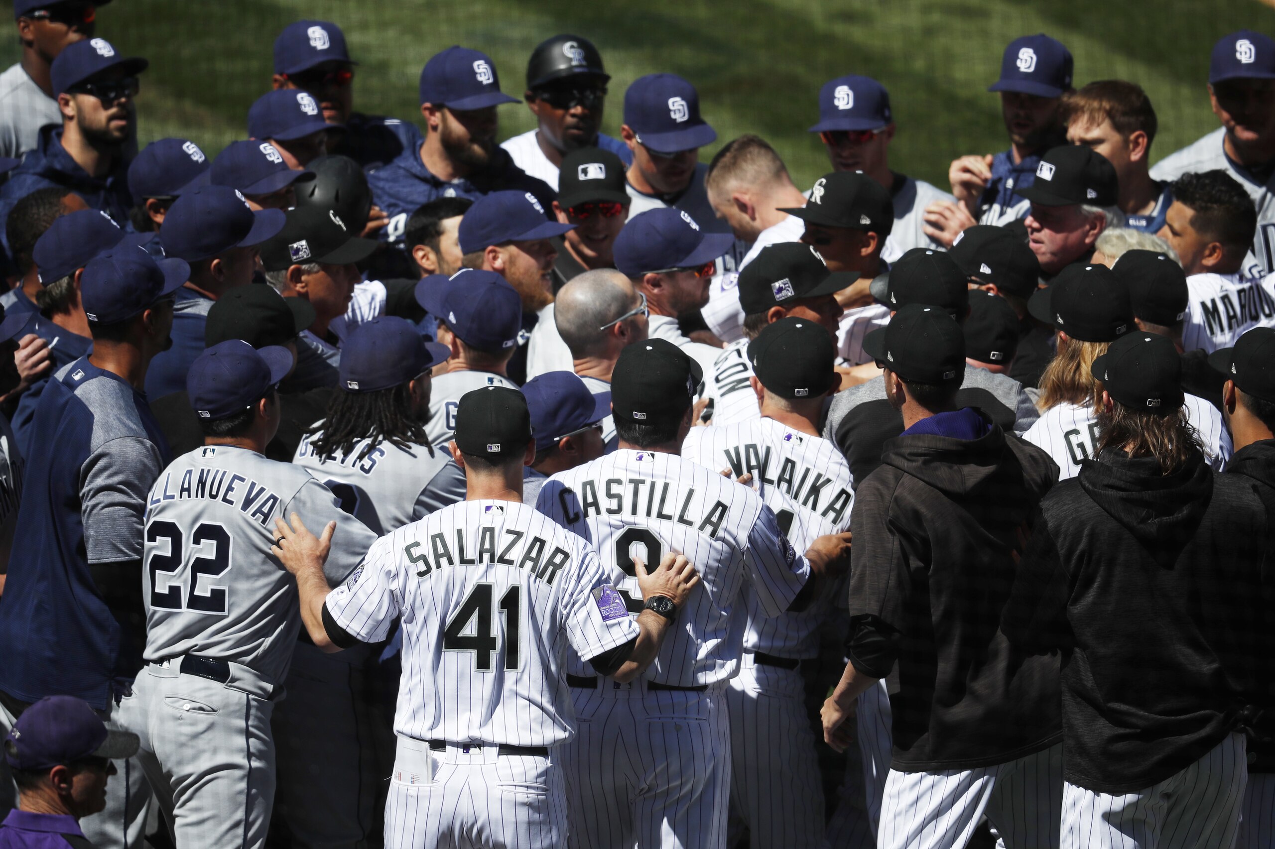 Players from the Colorado Rockies and San Diego Padres scuffle after Colorado's Nolan Arenado was hit by a pitch from Padres starting pitcher Luis Perdomo in the third inning of a baseball game, Wednesday, April 11, 2018, in Denver. (AP Photo/David Zalubowski) Players from the Colorado Rockies and San Diego Padres scuffle after Colorado's Nolan Arenado was hit by a pitch from Padres starting pitcher Luis Perdomo in the third inning of a baseball game, Wednesday, April 11, 2018, in Denver. (AP Photo/David Zalubowski)