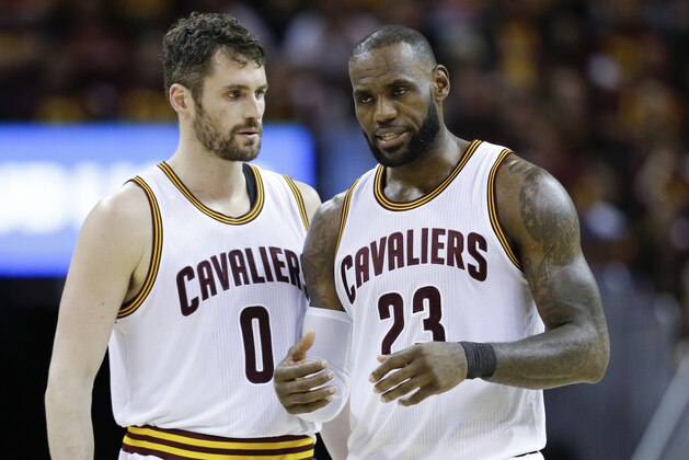 Cleveland Cavaliers' LeBron James (23) talks with Kevin Love (0) against the Boston Celtics during the second half of Game 3 of the NBA basketball Eastern Conference finals, Sunday, May 21, 2017, in Cleveland. The Celtics won 111-108. (AP Photo/Tony Dejak)