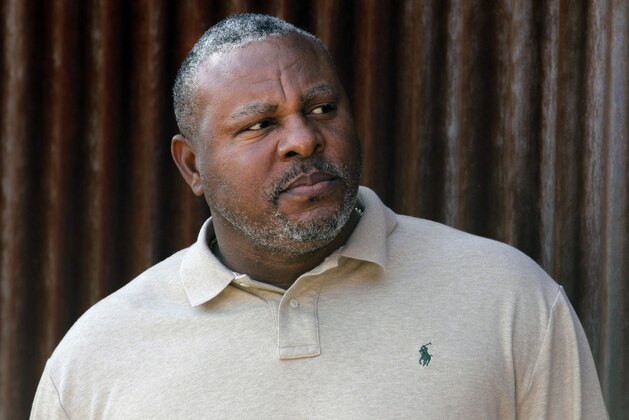 FILE - In this Tuesday, Feb. 28, 2012, file photo, former baseball player Albert Belle looks on as he visits the Cleveland Indians' spring training camp in Goodyear, Ariz. Belle has been arrested on indecent exposure and extreme driving under the influence charges following a spring training game in Arizona. Belle was taken into custody in Scottsdale, Arizona, on Sunday, March 25, 2018. (AP Photo/Jae C. Hong,File)