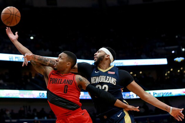 NEW ORLEANS, LA - JANUARY 12:  Damian Lillard #0 of the Portland Trail Blazers shoots over Anthony Davis #23 of the New Orleans Pelicans during the first half at the Smoothie King Center on January 12, 2018 in New Orleans, Louisiana. NOTE TO USER: User expressly acknowledges and agrees that, by downloading and or using this photograph, User is consenting to the terms and conditions of the Getty Images License Agreement.  (Photo by Sean Gardner/Getty Images)