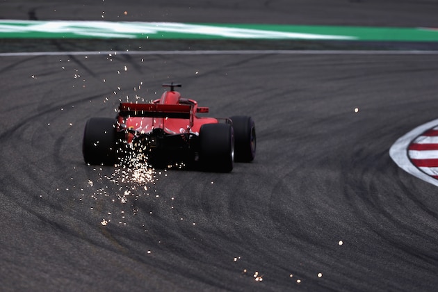 SHANGHAI, CHINA - APRIL 14: Sparks fly behind Sebastian Vettel of Germany driving the (5) Scuderia Ferrari SF71H on track during qualifying for the Formula One Grand Prix of China at Shanghai International Circuit on April 14, 2018 in Shanghai, China.  (Photo by Lars Baron/Getty Images)