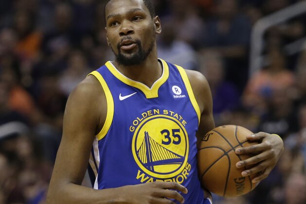 Golden State Warriors forward Kevin Durant (35) in the second half during an NBA basketball game against the Phoenix Suns, Sunday, April 8, 2018, in Phoenix. The Warriors defeated the Suns 117-100. (AP Photo/Rick Scuteri)