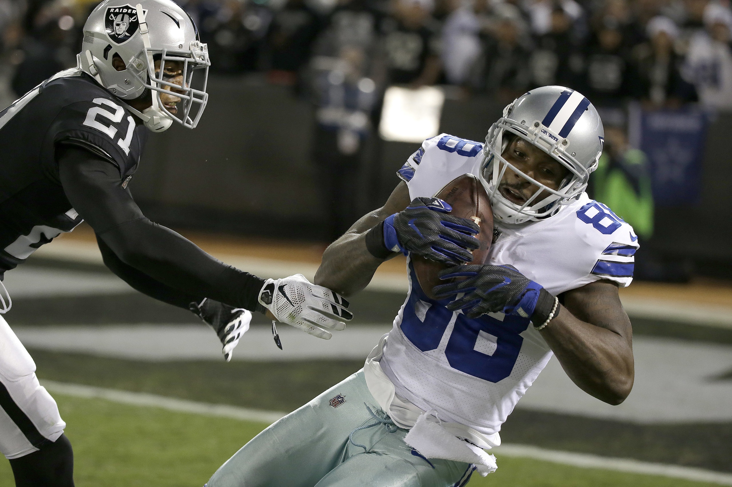 Dallas Cowboys wide receiver Dez Bryant (88) catches a pass against Oakland Raiders cornerback Sean Smith (21) during the second half of an NFL football game in Oakland, Calif., Sunday, Dec. 17, 2017. The Cowboys won 20-17. (AP Photo/Eric Risberg) Dallas Cowboys wide receiver Dez Bryant (88) catches a pass against Oakland Raiders cornerback Sean Smith (21) during the second half of an NFL football game in Oakland, Calif., Sunday, Dec. 17, 2017. The Cowboys won 20-17. (AP Photo/Eric Risberg)