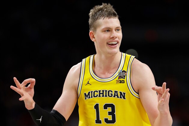 Michigan's Moritz Wagner (13) celebrates during the second half in the semifinals of the Final Four NCAA college basketball tournament against Loyola-Chicago, Saturday, March 31, 2018, in San Antonio. (AP Photo/Eric Gay)