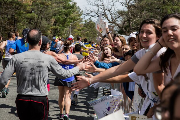 WELLESLEY, MA - APRIL 17: Crowds cheer on Boston Marathon runners in the iconic 'scream tunnel' near Wellesley College on April 17, 2017, in Wellesley Massachusetts. (Photo by Kayana Szymczak/Getty Images)