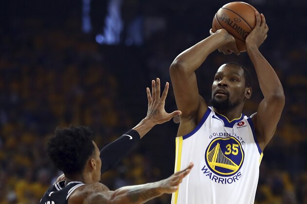Golden State Warriors' Kevin Durant, right, shoots against San Antonio Spurs' Dejounte Murray (5) during the first half in Game 1 of a first-round NBA basketball playoff series Saturday, April 14, 2018, in Oakland, Calif. (AP Photo/Ben Margot)