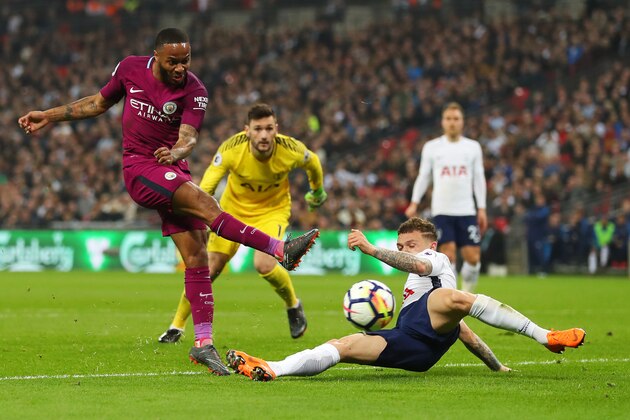 LONDON, ENGLAND - APRIL 14: Raheem Sterling of Manchester City shoots as Kieran Trippier of Tottenham Hotspur blocks during the Premier League match between Tottenham Hotspur and Manchester City at Wembley Stadium on April 14, 2018 in London, England.  (Photo by Catherine Ivill/Getty Images)