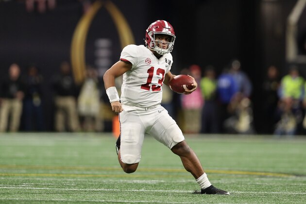 ATLANTA, GA - JANUARY 08:  Quarterback Tua Tagovailoa #13 of the Alabama Crimson Tide scrambles with the football against the Georgia Bulldogs during the CFP National Championship presented by AT&T at Mercedes-Benz Stadium on January 8, 2018 in Atlanta, Georgia. The  Crimson Tide defeated the Bulldogs 26-23.  (Photo by Christian Petersen/Getty Images)