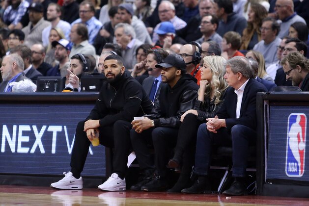 TORONTO, ON - APRIL 4:  Singer Drake looks on from his courtside seats during the first half of an NBA game between the Boston Celtics and the Toronto Raptors at Air Canada Centre on April 4, 2018 in Toronto, Canada.  NOTE TO USER: User expressly acknowledges and agrees that, by downloading and or using this photograph, User is consenting to the terms and conditions of the Getty Images License Agreement.  (Photo by Vaughn Ridley/Getty Images)