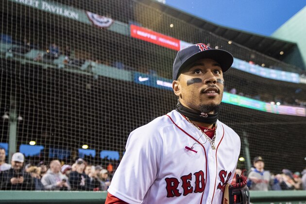 BOSTON, MA - APRIL 12: Mookie Betts #50 of the Boston Red Sox runs onto the field before a game against the New York Yankees on April 12, 2018 at Fenway Park in Boston, Massachusetts. (Photo by Billie Weiss/Boston Red Sox/Getty Images)