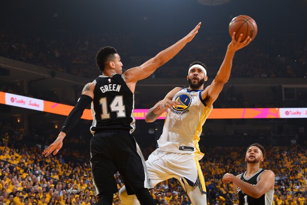 OAKLAND, CA - APRIL 14:  JaVale McGee #1 of the Golden State Warriors handles the ball against the San Antonio Spurs in Game One of Round One during the 2018 NBA Playoffs on April 14, 2018 at ORACLE Arena in Oakland, California. NOTE TO USER: User expressly acknowledges and agrees that, by downloading and or using this photograph, user is consenting to the terms and conditions of Getty Images License Agreement. Mandatory Copyright Notice: Copyright 2018 NBAE (Photo by Andrew D. Bernstein/NBAE via Getty Images)