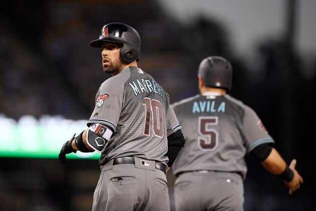 Arizona Diamondbacks' Deven Marrero, left, looks back toward the first base coach as Alex Avila runs in front of him after hitting a three-run home run during the fourth inning of a baseball game against the Los Angeles Dodgers, Saturday, April 14, 2018, in Los Angeles. Avila was later called out for passing Avila following a review. (AP Photo/Mark J. Terrill)