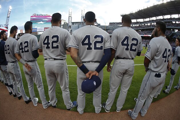 San Diego Padres all wear the number 42 as they stand for the U.S. national anthem before a baseball game against the Atlanta Braves Saturday, April 15, 2017, in Atlanta. Every Major League player is wearing the number 42 to honor Jackie Robinson. (AP Photo/John Bazemore)