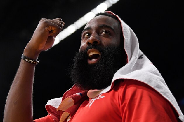 Houston Rockets guard James Harden gestures to a fan who was heckling him during the second half of the team's NBA basketball game against the Los Angeles Lakers on Tuesday, April 10, 2018, in Los Angeles. The Rockets won 105-99. (AP Photo/Mark J. Terrill)