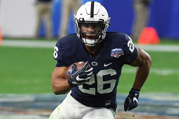 GLENDALE, AZ - DECEMBER 30:  Saquon Barkley #26 of Penn State Nittany Lions runs with the ball against the Washington Huskies during the Playstation Fiesta Bowl at University of Phoenix Stadium on December 30, 2017 in Glendale, Arizona.  (Photo by Norm Hall/Getty Images)