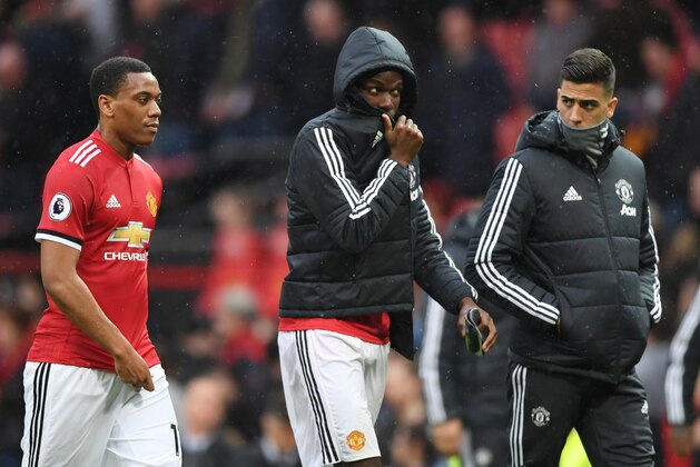 MANCHESTER, ENGLAND - APRIL 15:  Paul Pogba of Manchester United leaves the pitch looking dejected after the Premier League match between Manchester United and West Bromwich Albion at Old Trafford on April 15, 2018 in Manchester, England.  (Photo by Shaun Botterill/Getty Images)